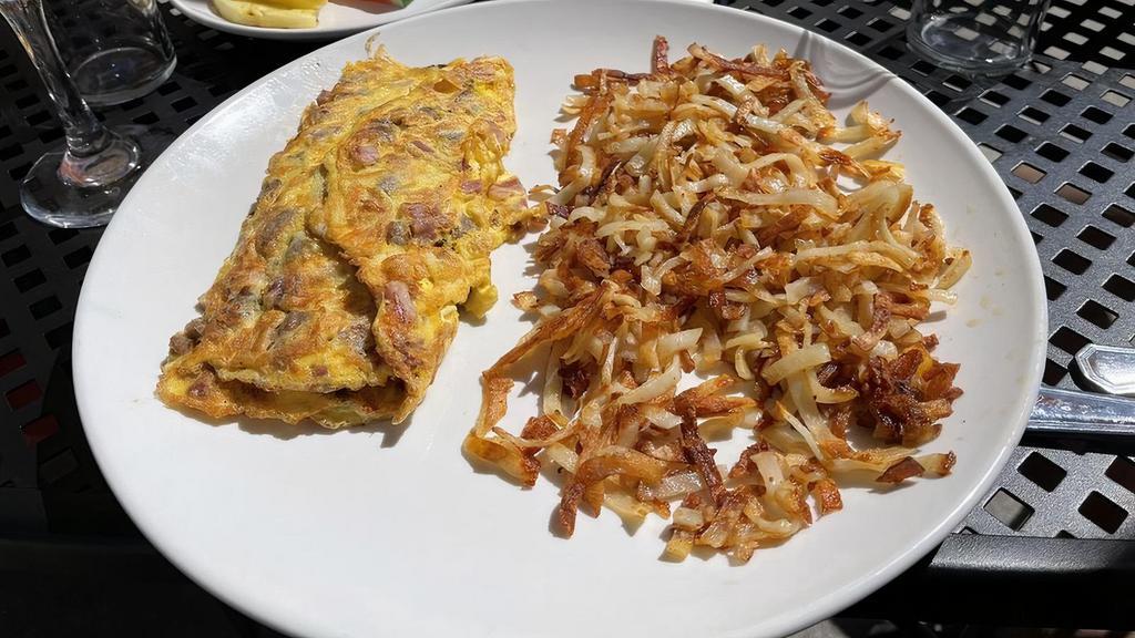 The Whole Hog · Bacon, sausage, ham, and cheddar cheese. Served with choice of breakfast potatoes or hash browns, and toast or fresh fruit.