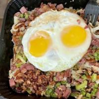 Corned Beef Hash & Eggs · House made corned beef, onion, green bell pepper, & 2 eggs. Served atop breakfast potatoes a...