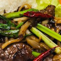 Mongolian Beef · Stir fried sliced beef sautéed with carrot, red pepper, onion & green onion.