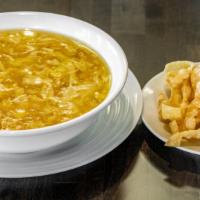 Egg Drop Soup · Velvety broth added with egg and corn.