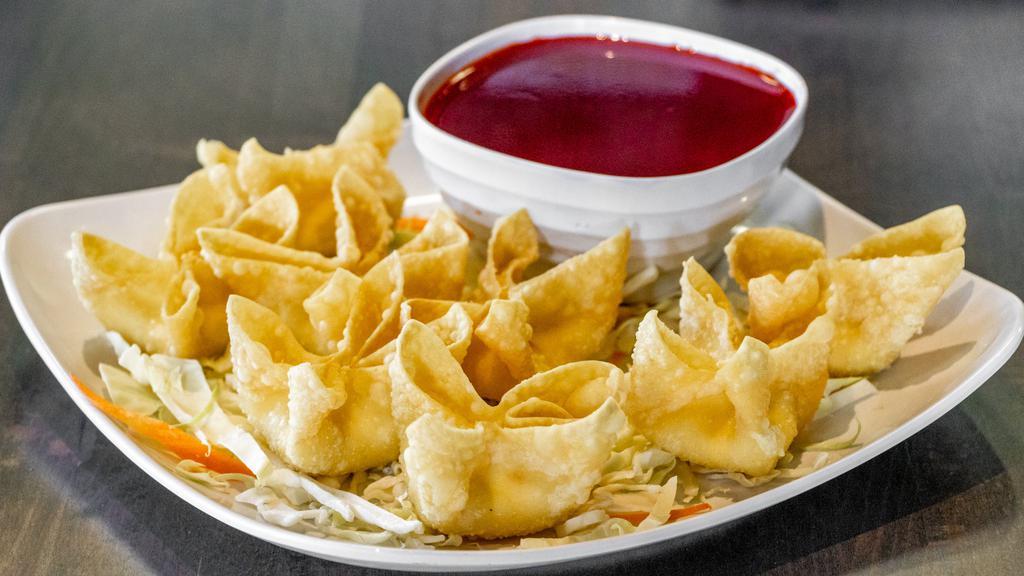 Crab Rangoons (8) · Crispy hand-folded wonton wrappers filled with crab, cream cheese, and scallions. Served with sweet and sour sauce.