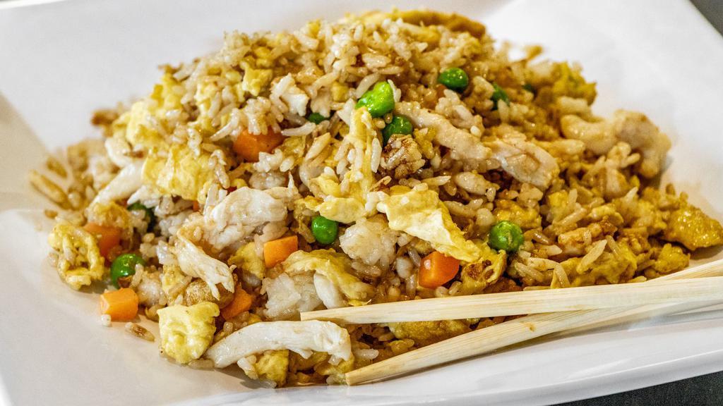 Chicken Fried Rice · Wok-tossed with egg, peas and carrots.
