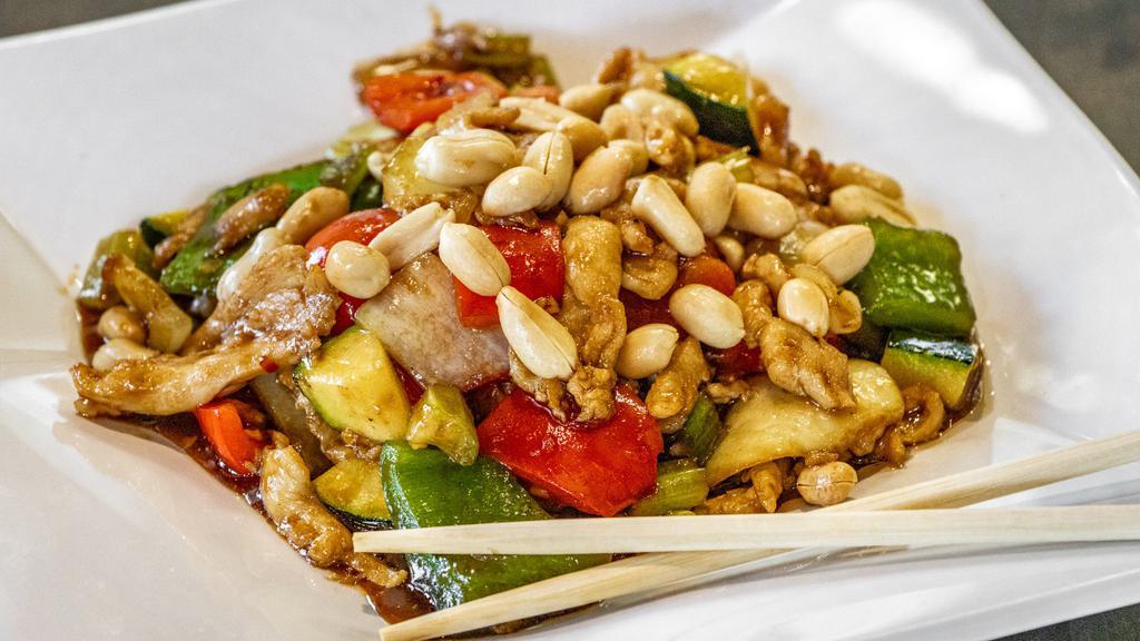 Kung Pao Chicken · Spicy. A Sichuan-inspired dish with stir-fried chicken, peanuts, celery, baby corn, zucchini, green/red bell peppers, and onions tossed in a chili sauce.