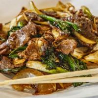 Mongolian Beef · Spicy. Spicy brown hoisin sauce with stir-fried beef, garlic, scallions, and white onions ov...