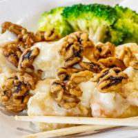 Walnut Shrimp · Tempura-battered shrimp tossed in a honey mayo sauce and topped with glazed walnuts and broc...