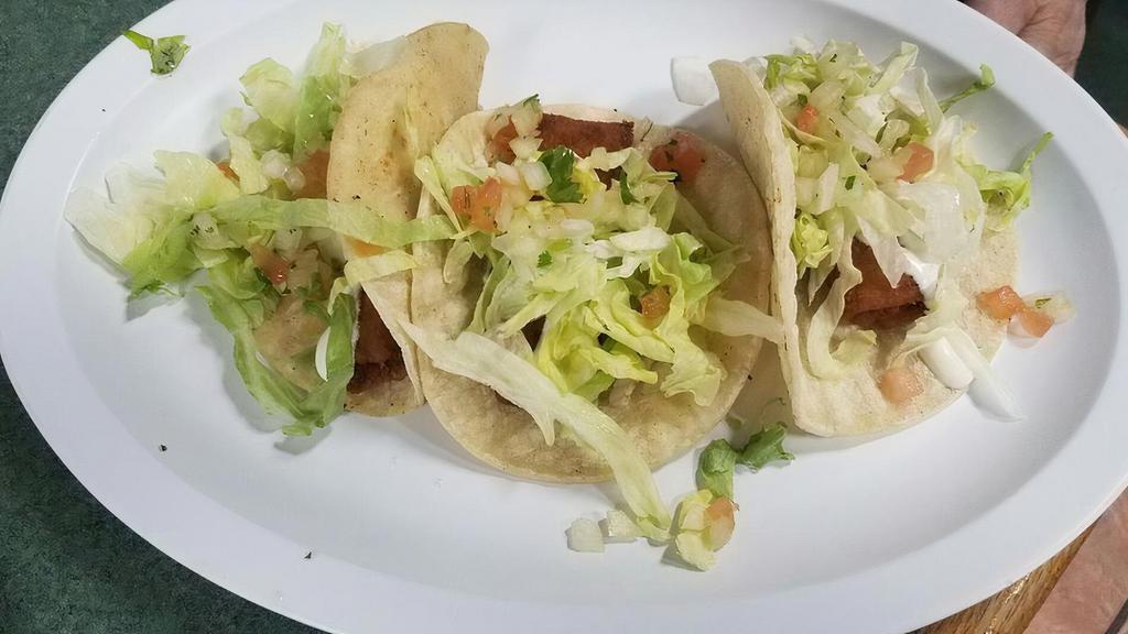 Fish Taco · Breaded pollock fish. Topped with our white sauce, lettuce, and pico.