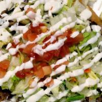 Taco Salad · Our taco salad is a fried flour tortilla filled with your choice of meat, beans, cheese, let...