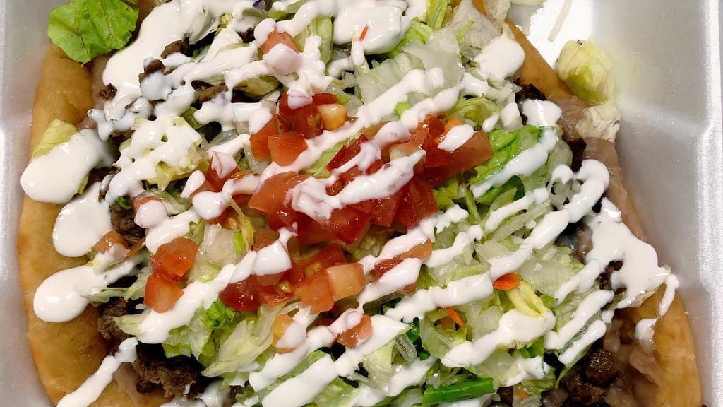 Taco Salad · Our taco salad is a fried flour tortilla filled with your choice of meat, beans, cheese, lettuce, sour cream, and tomato. If you do not want the shell, a better alternative is the burrito bowl.