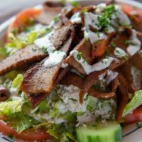 Gyro Salad · Gyro meat, grilled with onion and green pepper. Served on Greek salad with tzatziki and Feta...