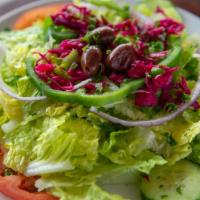 House Salad · Romaine, tomatoes, cucumbers, onions, green pepper, red cabbage, olive, and vinaigrette.