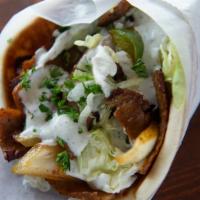 Regular Gyro · Rotisserie lamb and beef mix spiced, grilled with tomatoes, onions, and green peppers. lettu...