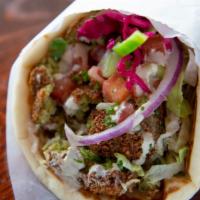Falafel Sandwich · A mix of garbanzo beans and parsley, spiced and fried. Served with tahini, hummus, onions, g...