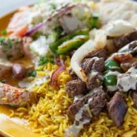 Beef Shawarma Plate · Marinated beef grilled with, tomatoes, onion, green pepper. Served with hummus, rice, Greek ...