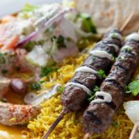 Kufta Kabab Plate · Minced lamb and beef mixed with parsley, spiced and grilled over an open flame. Served with ...