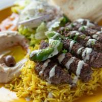 Kufta Plate · Minced lamb and beef mixed with parsley, spiced and grilled. Served with hummus, rice Greek ...