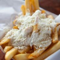 Greek Fries · Seasoned fries, garlic sauce, and Feta cheese.