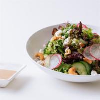 Spring Mix Salad · Tomato, cucumbers, radish, diced Monterey Jack cheese and cashew nuts with creamy sesame dre...