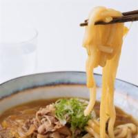 Curry Udon · Udon noodles, onions, shiitake mushrooms, scallions, sukiyaki  beef with umami curry soup.
