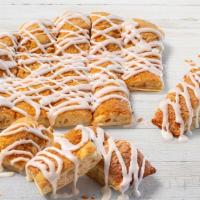 Cinna Bread · Cinnamon and sugar sprinkled on our homemade dough, topped with vanilla icing...  Ohhh so go...