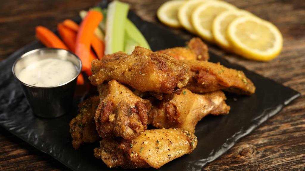 Traditional Lemon Pepper · 8 lemon pepper wings (mild heat), served with carrots & celery and a choice of blue cheese, classic ranch, or Sriracha ranch for dipping