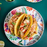 Fish Taco · Sea fresh fish taco grilled with butter and seasoning, decked with pico de gallo.