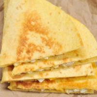 Folded Cheese Quesadilla · Freshly cooked tortilla filled with creamy cheese and folded in half.