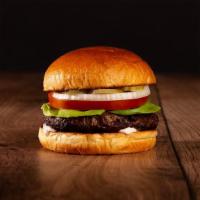 The Burger · Beef patty, lettuce, tomato, onion, pickles, spread, and melted cheddar cheese on a brioche ...