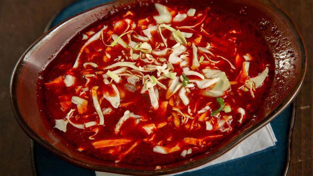 Pozole Soup · Guajillo Broth, Seasoned Pulled Pork, Hominy, Cabbage, Onions, Cilantro