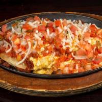 Vegan Huevos Rancheros · Vegan Scrambled Eggs, Two Corn Tostadas, Refried Beans, Ranchero Sauce, Vegan Cheese, Diced ...