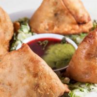Samosas · Two crispy pastries filled with your choice of fresh mixed vegetables or delicately spiced l...