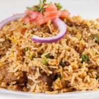 Royal Biryani · A classic mughlai dish of basmati rice cooked with curry, green peas, raisins, cashew nuts, ...