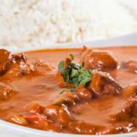 Curry Specialty · A traditional brown curry prepared with tomatoes, onions, and fresh herbs.