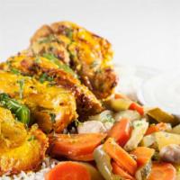Shish Taouk · Boneless chicken marinated in garlic, oregano, saffron, and other middle Eastern spices. Ser...