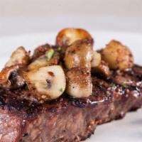 Petite New York Strip Steak · A 12 oz. Angus Beef New York strip steak grilled to order. Served with mushrooms and a choic...