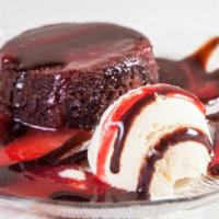 Chocolate Lava Cake · Rich chocolate cake served warm with a liquid chocolate truffle center. Served with vanilla ...