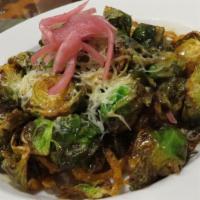Fried Brussels Sprouts · Topped with crispy onion straws, parmesan, herb vinaigrette and pickled red onion.