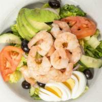 Traditional Shrimp Louie · Shrimp, romaine, tomato, boiled egg, cucumber, black olives, red onion and avocado. Louie dr...