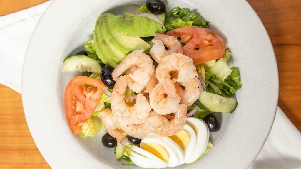 Traditional Shrimp Louie · Shrimp, romaine, tomato, boiled egg, cucumber, black olives, red onion and avocado. Louie dressing.