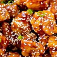 Sesame Chicken · Tender crispy chicken glazed with a sweet sesame sauce. Served with steamed white rice.