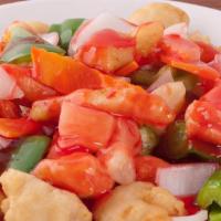 Sweet & Sour Chicken · Tender crispy white meat chicken with bell pepper, onion, carrots and pineapple glazed with ...