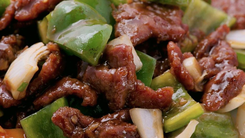 Beef Pepper Steak · Tender beef strips with diced onion and bell pepper stir fried in brown sauce.