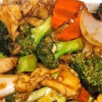 Broccoli Chicken · Sliced white meat chicken with broccoli, carrots and onions stir fried in a brown sauce. Ser...