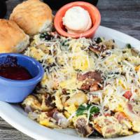 Joe’S Scramble · Four scrambled eggs, spinach, onions, tomatoes, bacon, potatoes & topped with parmesan cheese.