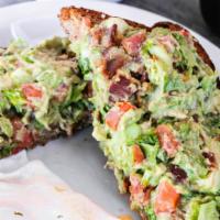 Blt Avocado Toast · A thick cut piece of wheat toast covered in a fresh bacon, lettuce & tomato avocado blend.  ...