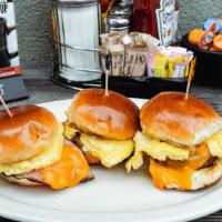 Breakfast Sliders Combo · Two sliders topped with your choice of ham, bacon or sausage; each topped with an egg* cooke...