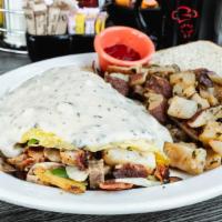 The Country · Bacon, sausage, mushrooms, bell peppers, onions & potatoes, topped with our savory sausage g...
