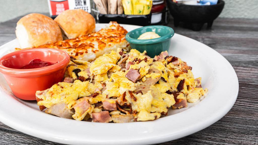 Meat Lovers · Three scrambled eggs loaded with ham, bacon & sausage.