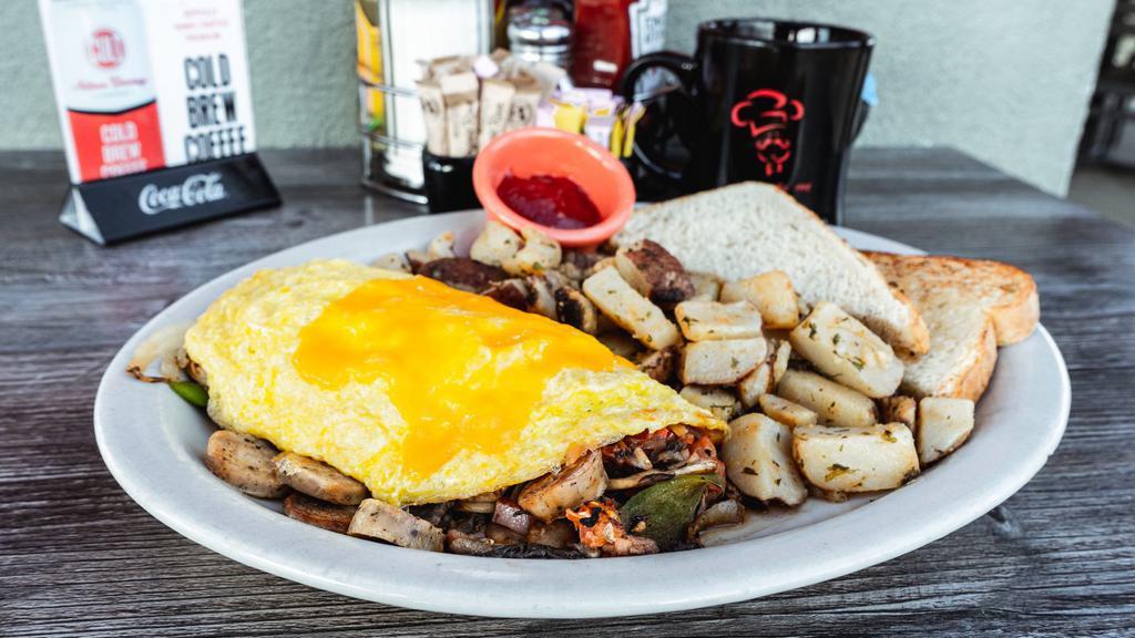 Biscuit'S Omelet · Ham, sausage, onions, mushrooms, bell peppers, tomatoes & cheddar cheese.