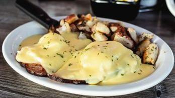 Ham Benedict · Grilled English muffin topped with ham, two poached eggs & hollandaise sauce.
