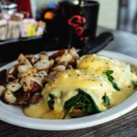 Florentine Benedict · Grilled English muffin topped with fresh spinach, sliced tomato, two poached eggs & hollanda...